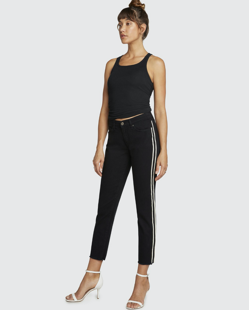 Mid Rise Cropped length jean with a slightly frayed raw hem